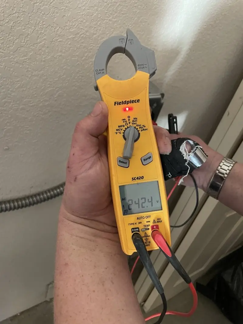 Voltage testing with clamp meter during Generator Installation in Woodburn